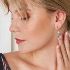 şeytani görünümlü bağlantılı küpeler